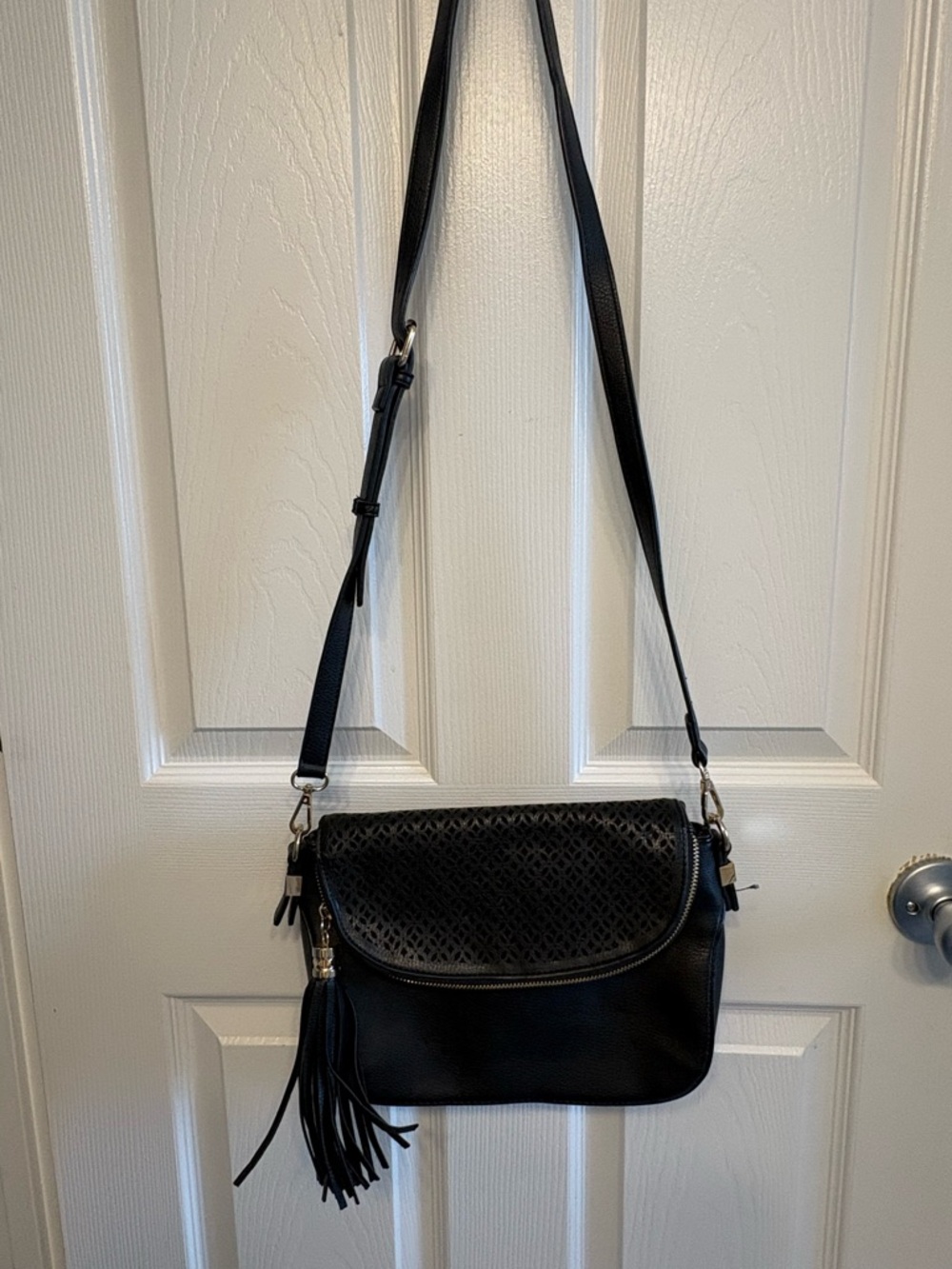 Madison West Black Laser-Cut Hobo Crossbody with Tassel
